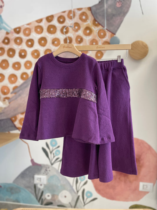 Maglia con inserto paillettes prugna e pantagonna ampia